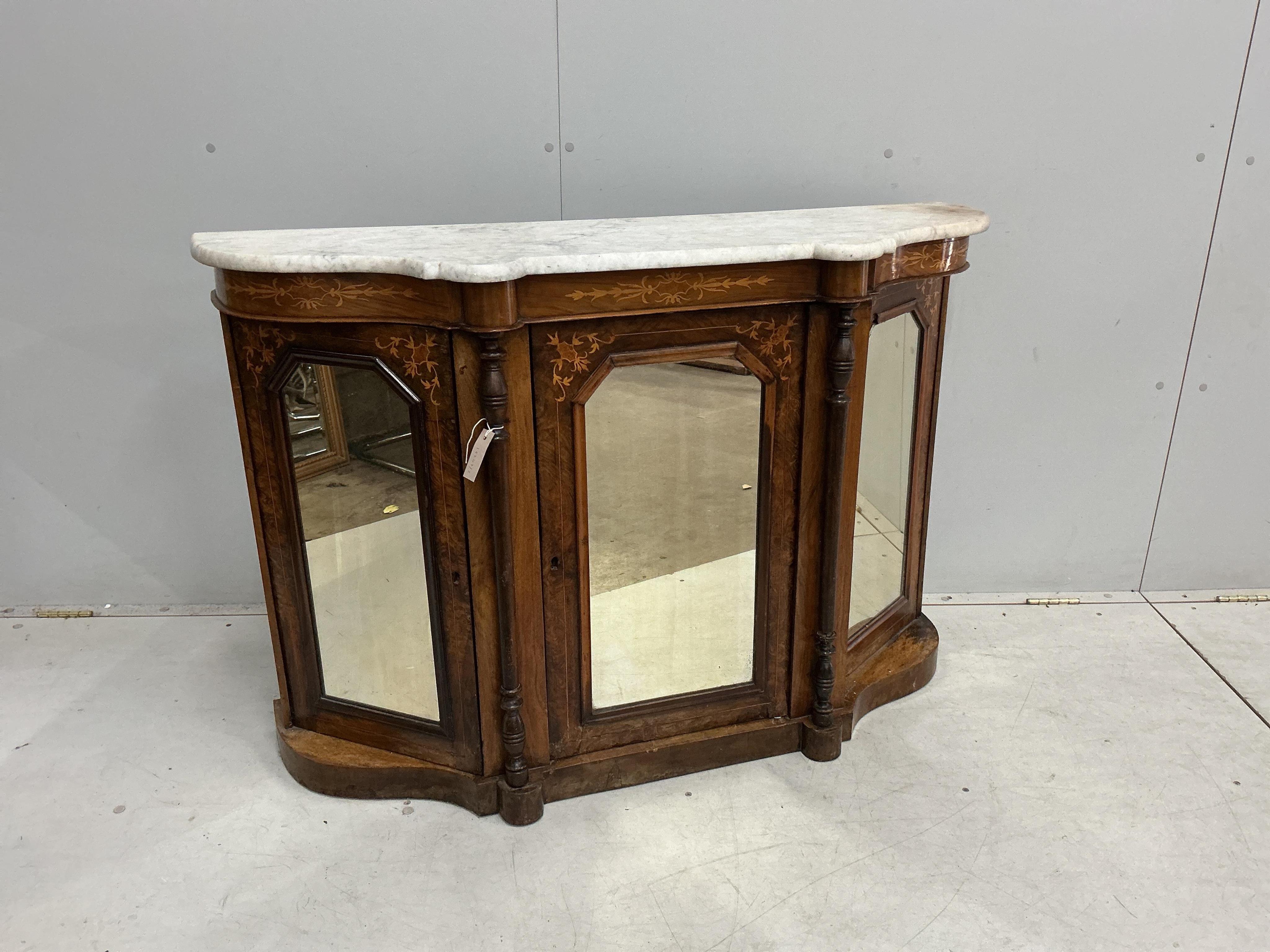 A late Victorian marquetry inlaid marble topped mirrored walnut side cabinet, width 122cm, depth 39cm, height 84cm